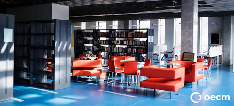 image of an open room with a layout of chairs and desks